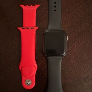Apple Watch Series 4 in titanium. Comes with black and red silicone strap 44mm